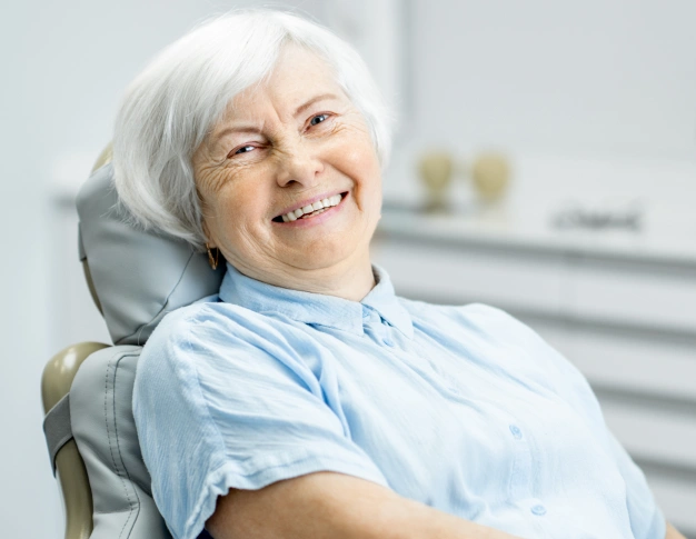 a older women seating dentist chair ad ready to receiving bone grafting treatment in Culver City