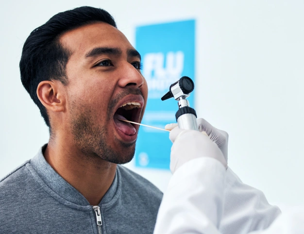 a dentist scanning oral cancer to his patients