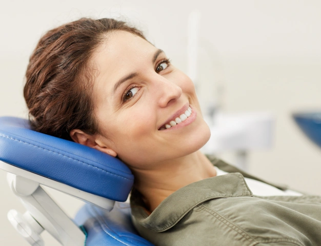a beautiful girl seating a dentist chair and ready to treat root canal treatments in Culver City